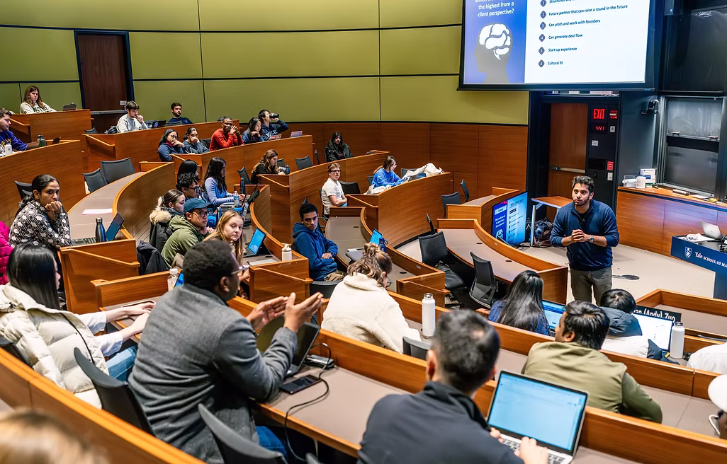 Hassan Akram fielding a question from an MBA audience during a career-strategy session