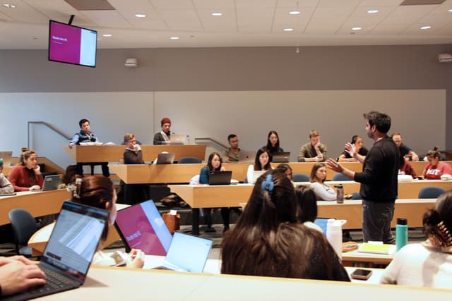 Hassan Akram delivering an MBA student-club session at MIT Sloan to an international audience