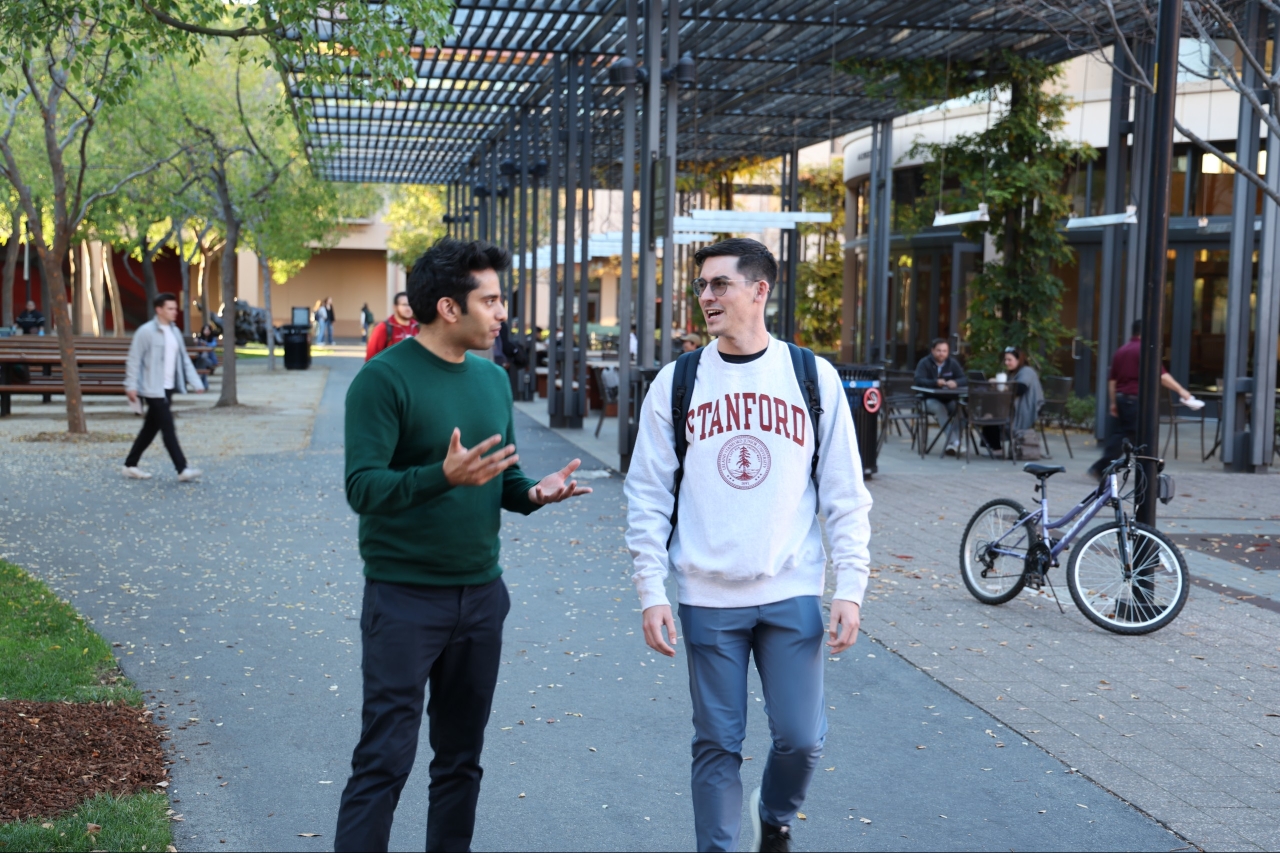 Hassan Akram with a Stanford student post-Private Client Advisory session.